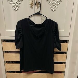 Black t-shirt with cute sleeves. Soft and only been worn a few times.